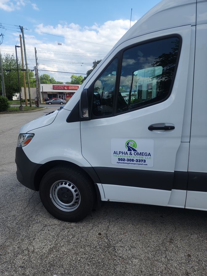 Alpha and Omega Transportation LLC logo on van